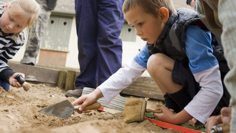 Children taking part in Dig for History, an archaeology day, at Sutton Hoo, Suffolk
